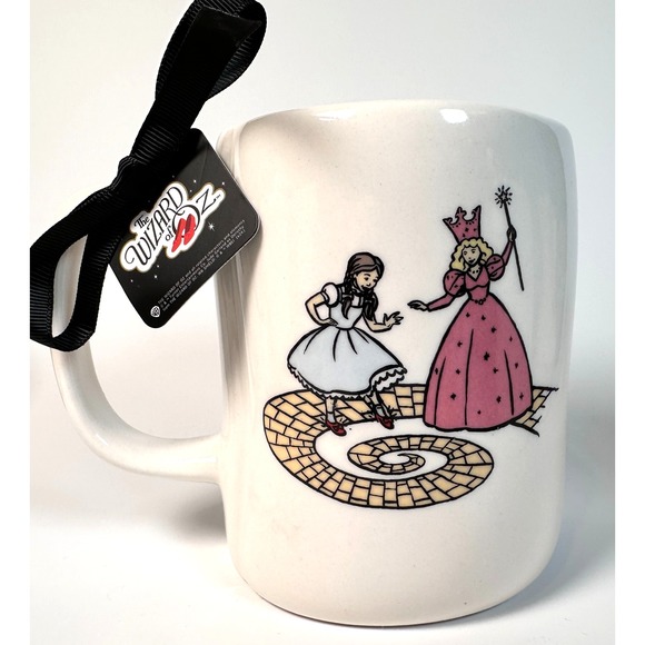 Rae Dunn Wizard of Oz Mug Follow the Yellow Brick Road Dorothy & Glenda 2 Sided - Picture 1 of 9